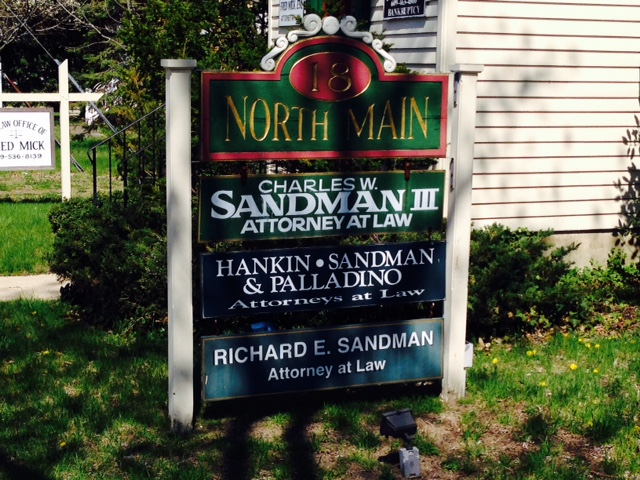 Photo of the exterior sign for the law office of Charles W. Sandman, III